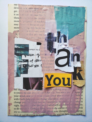 Painted torn book page with cut out words that say "thank you"