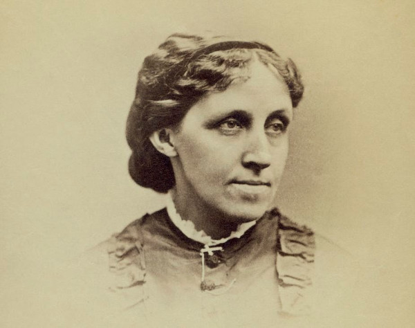 Vignette sepia photographic portrait of young woman made in the 1870s.