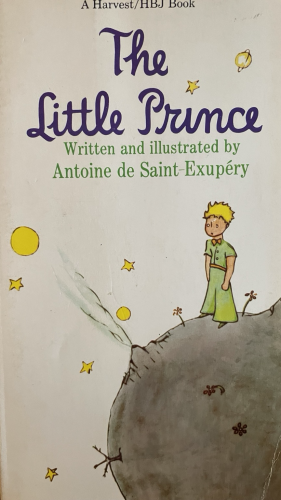 Book cover with a drawing of a child standing on a tiny planet