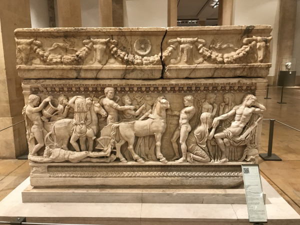 Very large stone sarcophagus carved with various, mostly nude male figures playing out different parts of the Achilles story.