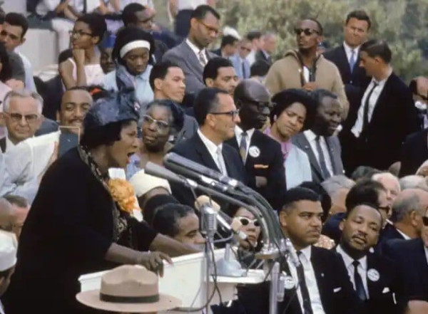 Martin Luther King Jr. (bottom right) listens to gospel singer Mahalia Jackson earlier during the March on Washington on Aug. 28, 1963. Bob Parent/Getty Images