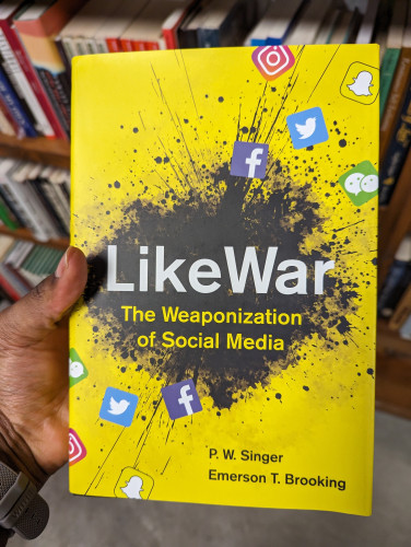 Myself holding LikeWar: The Weaponization of Social Media 