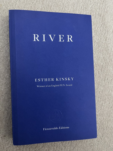 Cover of River by Esther Kinsky. White writing on plain blue cover, denoting a Fitzcarraldo Editions fiction title.