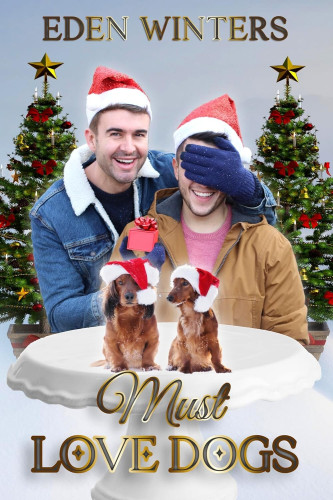 Cover - Must Love Dogs by Eden Winters - Two handsome young white men in winter jackets and Santa hats smiling, one with a blue mittened hand over the other's eyes, in front of a bird bath with two dachshunds in Santa hats, two Christmas trees in the background