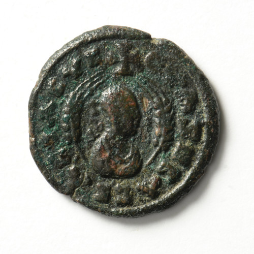 Badly worn ancient Roman coin.