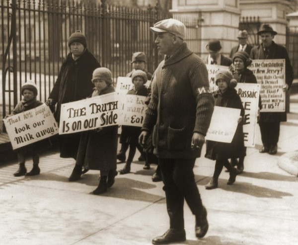 Children of strikers in the 1926 Passaic Textile Strike picketing outside the White House, Washington, DC. In overcoats and caps. Their signs read “The truth is on our side,” and “That 10% wage cut just took our milk away.” By News photo, digitized from the original negative by the Library of Congress. Additional digital editing by Tim Davenport for Wikipedia, no copyright claimed. - National Photo Company Collection.Reproduction Number: LC-USZ62-56286 (b&amp;w film copy neg.)Rights Advisory: No known restrictions on publication.Call Number: LOT 12298, v. 2 &lt;item&gt; [P&amp;P], Public Domain, https://commons.wikimedia.org/w/index.php?curid=90051323